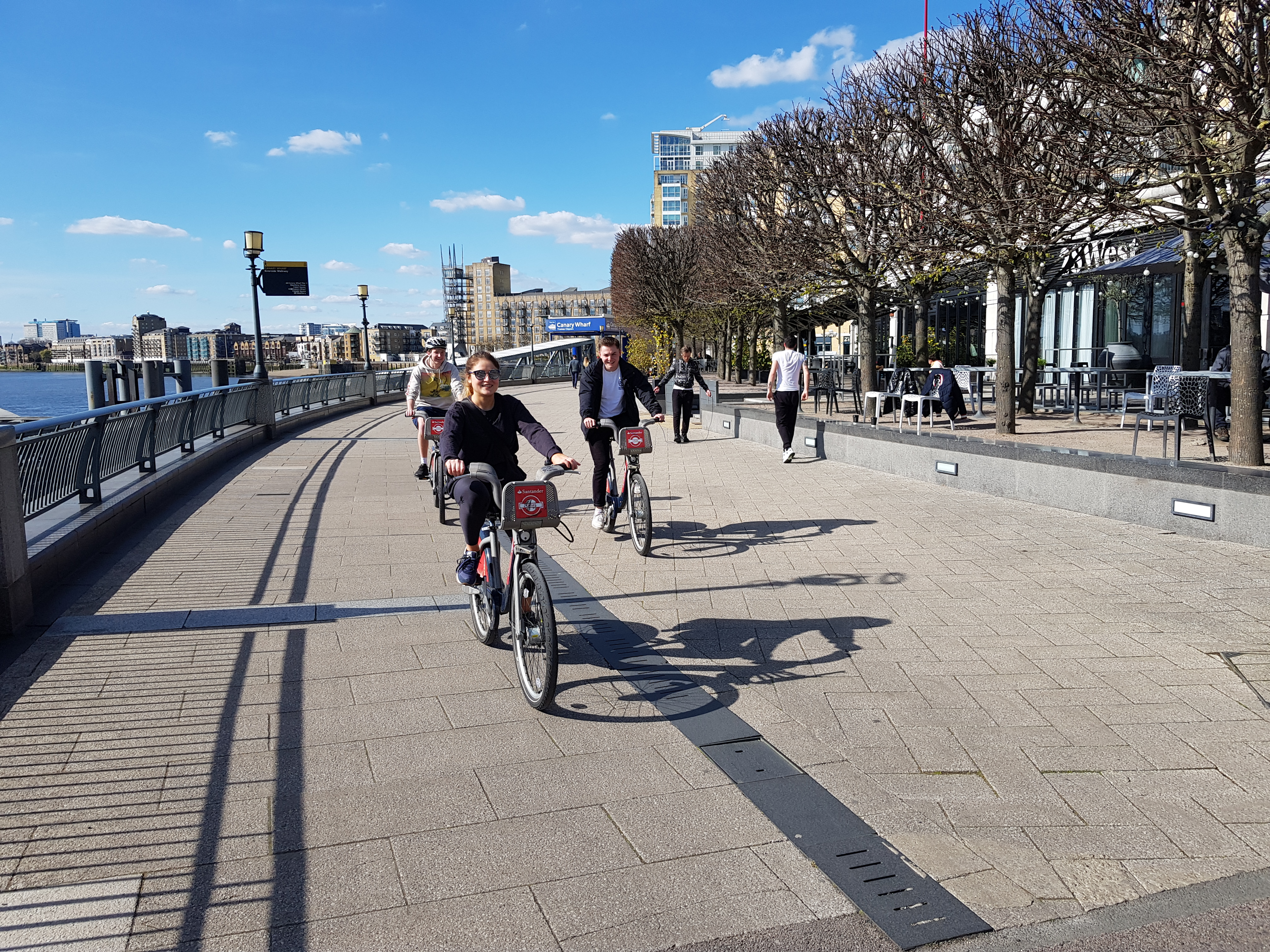 Cyclists and joggers next to the Thames, Docklands